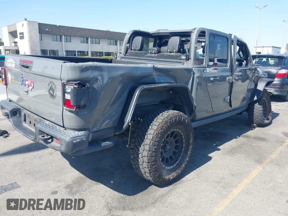 2021 Jeep Gladiator 80th Anniversary z VIN 1C6HJTAG7ML564981, wystawiony jako IAAI lot #42455062 z przebiegiem 89 721 mil mil oraz . Historia ofert i sprzedaży dostępna na DreamBid. Obrazek 4.