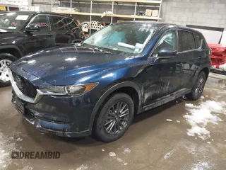 2020 Mazda CX-5 Touring z VIN JM3KFBCM9L0843045, wystawiony jako IAAI lot #41361008 z przebiegiem 76 107 mil mil oraz . Historia ofert i sprzedaży dostępna na DreamBid. Obrazek 2.
