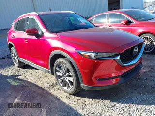 2020 Mazda CX-5 Grand Touring with VIN JM3KFADM8L0846818, listed as a IAAI auction lot 41224843 with 123,554 mi miles. Bid and sale history available at carsss.com. Image 1.