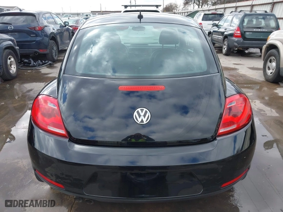 2012 Volkswagen Beetle 2.5L w/Sun/Sound/Nav PZEV with VIN 3VWHP7AT0CM623536, listed as a IAAI auction lot 41351333 with 106,600 mi miles. Bid and sale history available at carsss.com. Image 16.