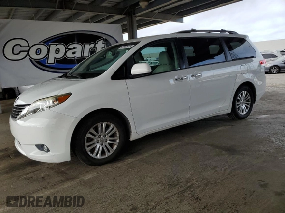 2012 Toyota Sienna XLE AAS with VIN 5TDYK3DC7CS275496, listed as a Copart auction lot 62612815 with 130,027 mi miles and Salvage title. Bid and sale history available at DreamBid. Image 1.