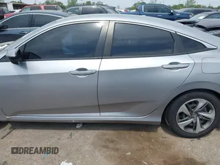 2019 Honda Civic LX with VIN 19XFC2F66KE026931, listed as a IAAI auction lot 41885137 with 55,057 mi miles and . Bid and sale history available at DreamBid. Image 14.