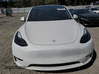 2023 Tesla Model Y Long Range z VIN 7SAYGDEE7PF788932, wystawiony jako Copart lot #52822515 z przebiegiem 33 007 mil mil oraz Szkoda całkowita • Salvage title. Historia ofert i sprzedaży dostępna na DreamBid. Obrazek 5.
