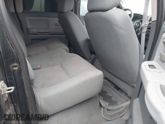 2007 Dodge Dakota SLT z VIN 1D7HW48P87S271192, wystawiony jako IAAI lot #41421142 z przebiegiem 198 588 mil mil oraz . Historia ofert i sprzedaży dostępna na DreamBid. Obrazek 8.