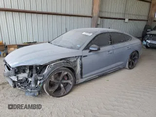 2023 Audi RS 5 Sportback z VIN WUAAWCF57PA903163, wystawiony jako Copart lot #77034994 z przebiegiem 13 115 mil mil oraz Szkoda całkowita • Salvage title. Historia ofert i sprzedaży dostępna na DreamBid. Obrazek 1.