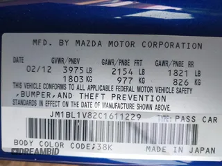 2012 Mazda Mazda3 i Touring with VIN JM1BL1V82C1611229, listed as a IAAI auction lot 41809234 with 124,929 mi miles. Bid and sale history available at carsss.com. Image 9.