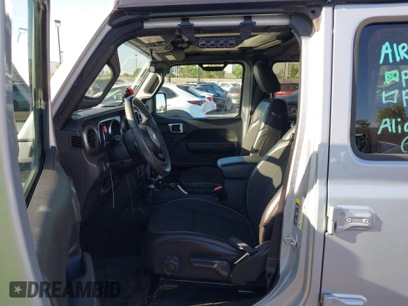 2023 Jeep Wrangler Willys with VIN 1C4HJXDG3PW577807, listed as a IAAI auction lot 42323674 with 28,808 mi miles and . Bid and sale history available at DreamBid. Image 5.