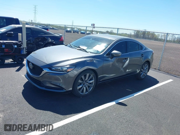 2020 Mazda 6 Grand Touring with VIN JM1GL1TY0L1522025, listed as a IAAI auction lot 41876429 with 68,101 mi miles and . Bid and sale history available at DreamBid. Image 2.