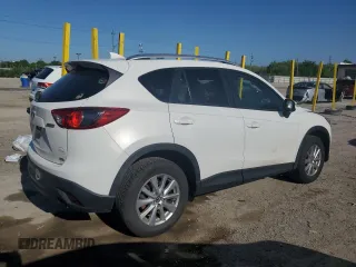 2016 Mazda CX-5 Touring z VIN JM3KE2CYXG0683673, wystawiony jako Copart lot #56724025 z przebiegiem 107 293 mil mil oraz Szkoda całkowita • Salvage title. Historia ofert i sprzedaży dostępna na DreamBid. Obrazek 3.