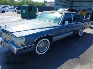 1991 Cadillac Brougham z VIN 1G6DW547XMR708197, wystawiony jako IAAI lot #42112042 z przebiegiem Nie podano mil oraz . Historia ofert i sprzedaży dostępna na DreamBid. Obrazek 2.