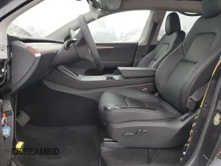 2024 Tesla Model Y with VIN 7SAYGDED5RF093410, listed as a Copart auction lot 50557225 with 6,396 mi miles and Salvage Title. Bid and sale history available at DreamBid. Image 7.