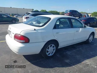 1999 Mazda 626 ES with VIN 1YVGF22C4X5841892, listed as a IAAI auction lot 41678373 with 66,981 mi miles. Bid and sale history available at carsss.com. Image 4.
