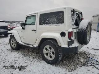 2014 Jeep Wrangler Sahara with VIN 1C4AJWBG5EL327823, listed as a Copart auction lot 85472404 with 136,132 mi miles and Clean Title. Bid and sale history available at DreamBid. Image 2.
