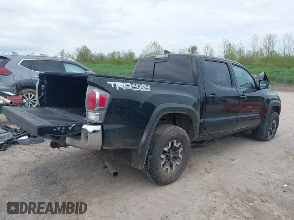 2023 Toyota Tacoma SR with VIN 3TMCZ5AN2PM598464, listed as a IAAI auction lot 42238032 with 35,597 mi miles and . Bid and sale history available at DreamBid. Image 4.