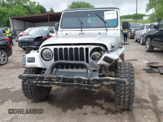2004 Jeep Wrangler X with VIN 1J4FA39S24P701806, listed as a IAAI auction lot 42218100 with 72,757 mi miles and . Bid and sale history available at DreamBid. Image 12.