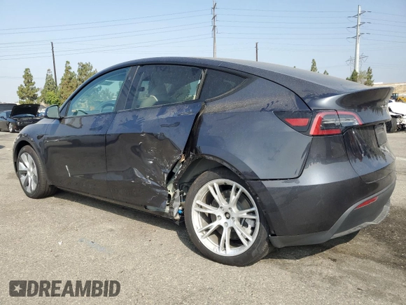 2024 Tesla Model Y Long Range with VIN 7SAYGDEE1RA266653, listed as a Copart auction lot 62277865 with 8,189 mi miles and Salvage title. Bid and sale history available at DreamBid. Image 2.