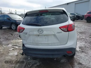 2014 Mazda CX-5 Grand Touring with VIN JM3KE4DY9E0300491, listed as a IAAI auction lot 41657153 with 157,394 mi miles and . Bid and sale history available at DreamBid. Image 16.