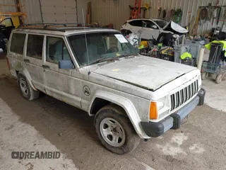1996 Jeep Cherokee Sport z VIN 1J4FJ68S7TL263437, wystawiony jako IAAI lot #42513022 z przebiegiem 158 561 mil mil oraz . Historia ofert i sprzedaży dostępna na DreamBid. Obrazek 1.