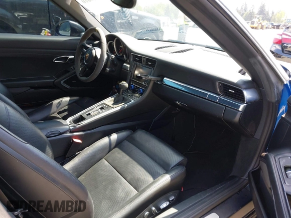 2014 Porsche 911 Carrera z VIN WP0CA2A94ES140857, wystawiony jako IAAI lot #42159010 z przebiegiem 46 230 mil mil oraz . Historia ofert i sprzedaży dostępna na DreamBid. Obrazek 5.