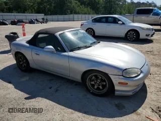 1999 Mazda MX-5 Miata z VIN JM1NB3538X0112611, wystawiony jako Copart lot #54732095 z przebiegiem 173 763 mil mil oraz Szkoda całkowita • Salvage title. Historia ofert i sprzedaży dostępna na DreamBid. Obrazek 4.