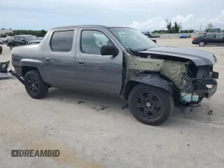 2012 Honda Ridgeline RTS with VIN 5FPYK1F46CB460256, listed as a Copart auction lot 70879644 with 136,217 mi miles and Salvage Title. Bid and sale history available at carsss.com. Image 4.