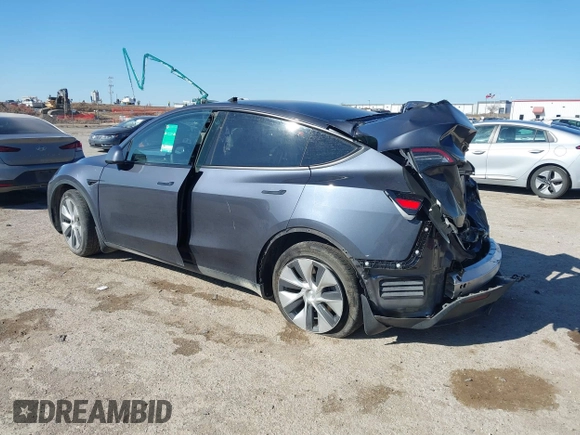 2023 Tesla Model Y Long Range with VIN 7SAYGAEE8PF667728, listed as a IAAI auction lot 41839771 with 32,654 mi miles and . Bid and sale history available at DreamBid. Image 3.