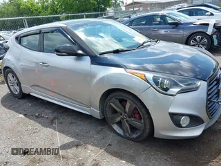 2013 Hyundai Veloster Turbo z VIN KMHTC6AE3DU136005, wystawiony jako IAAI lot #42243308 z przebiegiem 118 257 mil mil oraz . Historia ofert i sprzedaży dostępna na DreamBid. Obrazek 1.