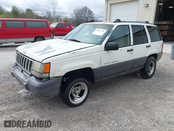 1996 Jeep Grand Cherokee Laredo with VIN 1J4FX58S1TC278511, listed as a IAAI auction lot 41837339 with 303,947 mi miles. Bid and sale history available at carsss.com. Image 2.