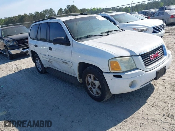 2003 GMC Envoy SLT with VIN 1GKDS13S832300090, listed as a IAAI auction lot 41993627 with 210,631 mi miles. Bid and sale history available at carsss.com. Image 1.