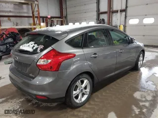 2014 Ford Focus SE with VIN 1FADP3K21EL207666, listed as a IAAI auction lot 41846327 with 148,293 mi miles. Bid and sale history available at carsss.com. Image 4.