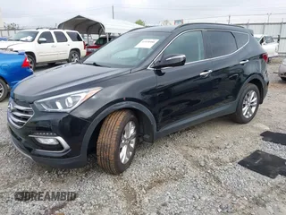 2018 Hyundai Santa Fe 2.0T z VIN 5NMZUDLA3JH057978, wystawiony jako IAAI lot #41930580 z przebiegiem 118 100 mil mil oraz . Historia ofert i sprzedaży dostępna na DreamBid. Obrazek 2.