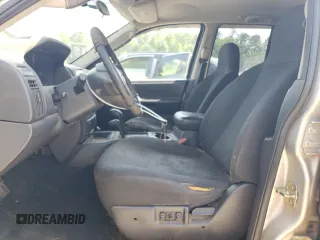 2004 Jeep Grand Cherokee Laredo z VIN 1J4GW48S84C177274, wystawiony jako Copart lot #56468855 z przebiegiem 236 014 mil mil oraz Szkoda całkowita • Salvage title. Historia ofert i sprzedaży dostępna na DreamBid. Obrazek 7.