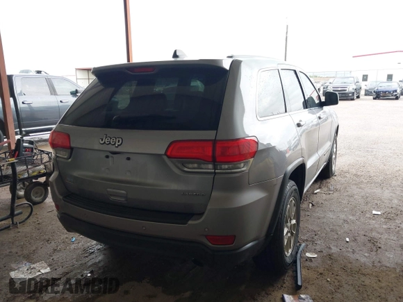 2018 Jeep Grand Cherokee Laredo E with VIN 1C4RJEAG1JC275356, listed as a IAAI auction lot 42150422 with 69,720 mi miles and . Bid and sale history available at DreamBid. Image 4.