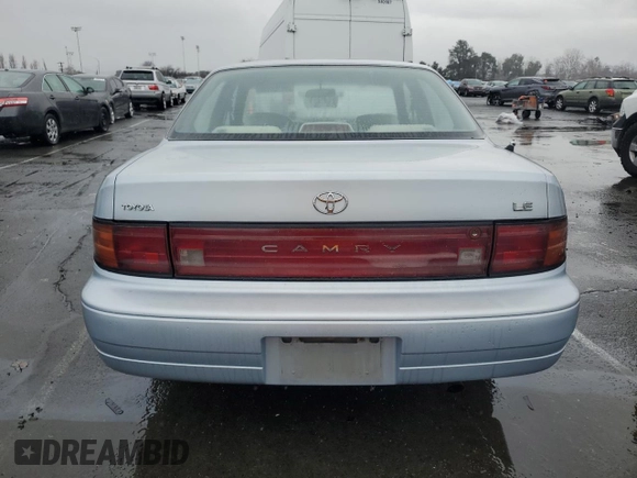 1994 Toyota Camry LE with VIN 4T1SK12E8RU411682, listed as a Copart auction lot 44153535 with 214,022 mi miles and Salvage Title. Bid and sale history available at carsss.com. Image 6.