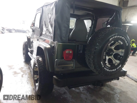1998 Jeep Wrangler SE with VIN 1J4FY29P2WP733255, listed as a IAAI auction lot 41554602 with 157,316 mi miles. Bid and sale history available at carsss.com. Image 3.