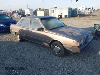 1985 Toyota Camry z VIN JT2SV12EXF0291360, wystawiony jako IAAI lot #42094530 z przebiegiem 426 444 mil mil oraz . Historia ofert i sprzedaży dostępna na DreamBid. Obrazek 1.