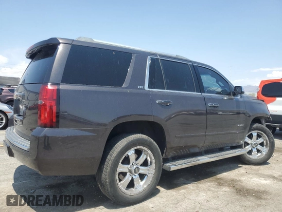 2015 Chevrolet Tahoe LTZ with VIN 1GNSKCKC2FR157035, listed as a Copart auction lot 59990415 with Not provided miles and Salvage title. Bid and sale history available at DreamBid. Image 3.