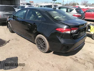 2021 Toyota Corolla LE with VIN JTDEPMAE5MJ126390, listed as a IAAI auction lot 41669331 with 77,398 mi miles. Bid and sale history available at carsss.com. Image 3.