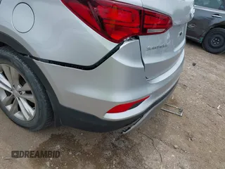 2018 Hyundai Santa Fe 2.0T z VIN 5XYZU4LA9JG537310, wystawiony jako IAAI lot #42393689 z przebiegiem Nie podano mil oraz . Historia ofert i sprzedaży dostępna na DreamBid. Obrazek 6.