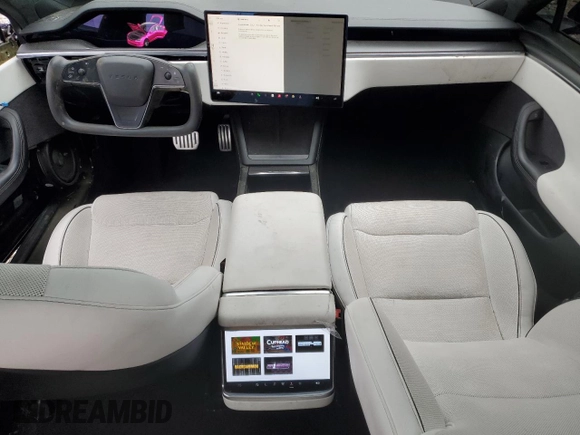 2023 Tesla Model S Plaid with VIN 5YJSA1E67PF511354, listed as a Copart auction lot 56648975 with 69,002 mi miles and Salvage title. Bid and sale history available at DreamBid. Image 8.