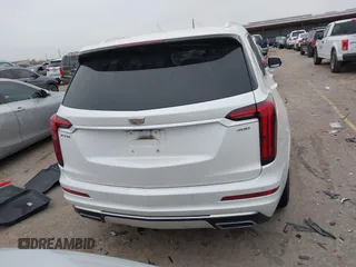 2021 Cadillac XT6 Premium Luxury z VIN 1GYKPCRSXMZ169206, wystawiony jako IAAI lot #41581841 z przebiegiem 64 789 mil mil oraz . Historia ofert i sprzedaży dostępna na DreamBid. Obrazek 16.