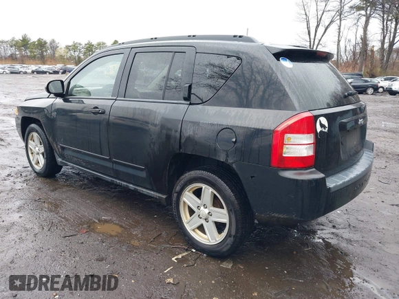 2008 Jeep Compass Sport with VIN 1J8FT47028D725448, listed as a IAAI auction lot 41972561 with 198,524 mi miles. Bid and sale history available at carsss.com. Image 3.