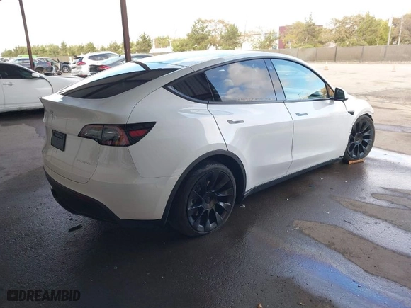 2023 Tesla Model Y Long Range with VIN 7SAYGAEE0PF787216, listed as a IAAI auction lot 41589954 with 17,985 mi miles. Bid and sale history available at carsss.com. Image 4.