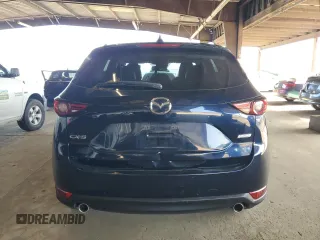 2019 Mazda CX-5 Grand Touring with VIN JM3KFADM3K1539890, listed as a Copart auction lot 57809835 with 56,079 mi miles and Salvage title. Bid and sale history available at DreamBid. Image 6.