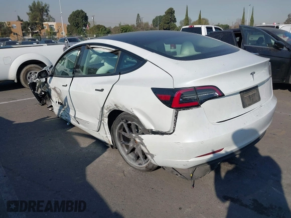 2022 Tesla Model 3 with VIN 5YJ3E1EA4NF319237, listed as a IAAI auction lot 41263761 with 44,384 mi miles and . Bid and sale history available at DreamBid. Image 3.