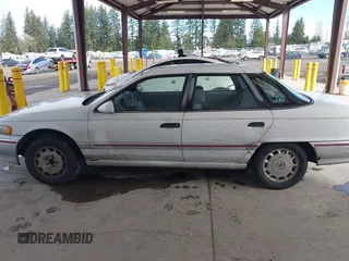 1992 Mercury Sable z VIN 1MECM5049NG647978, wystawiony jako IAAI lot #41805346 z przebiegiem 23 634 mil mil oraz . Historia ofert i sprzedaży dostępna na DreamBid. Obrazek 14.