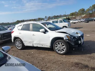 2014 Mazda CX-5 Grand Touring with VIN JM3KE4DY7E0425201, listed as a IAAI auction lot 41803597 with 118,867 mi miles. Bid and sale history available at carsss.com. Image 14.