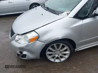 2011 Suzuki SX4 with VIN JS2YC5A41B6300385, listed as a IAAI auction lot 41570810 with 117,847 mi miles and . Bid and sale history available at DreamBid. Image 6.