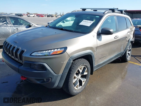 2017 Jeep Cherokee Trailhawk L Plus with VIN 1C4PJMBB6HW654172, listed as a IAAI auction lot 41851236 with 104,263 mi miles. Bid and sale history available at carsss.com. Image 2.