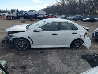 2014 Mitsubishi Lancer Evolution MR with VIN JA32W5FV5EU017592, listed as a IAAI auction lot 41158408 with 97,614 mi miles. Bid and sale history available at carsss.com. Image 15.